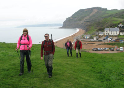 Photo of walkers above Seatown with Golden Cap in the background – May 1, 2024