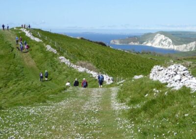 Photo of walkers with Worbarrow Bay in the far distance – May 4, 2024