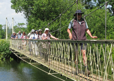 Photo of group crossing the River Stour on Canford suspension bridge – June 1, 2024