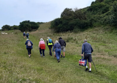 Photo of walkers climbing West Hill – July 11, 2024