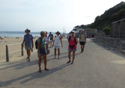 Photo of walkers on the promenade at Shore Road Beach, Poole – August 1, 2024