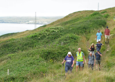 Photo taken of coast path with the westerly set of nautical mile markers in the distance – August 14, 2024