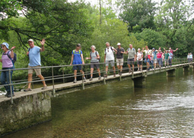 Photo of walkers crossing the River Frome – August 28, 2024