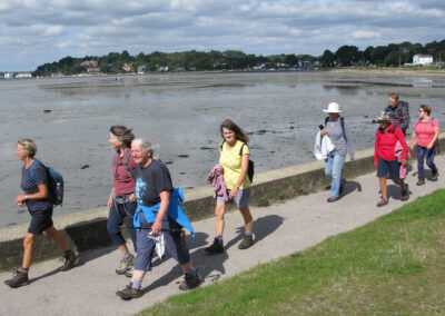 Photo of walkers approaching Sandbanks – September 14, 2024