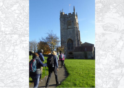 Photo of walkers passing Bere Regis church – November 13, 2024