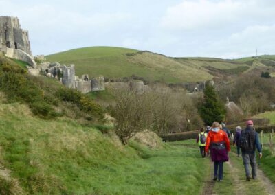 Photo of walkers approaching the castle of Corfe – December 4, 2024