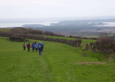 Photo of walkers descending Kingswood Down – December 11, 2024