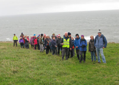 Group photo taken above the coast path – December 18, 2024