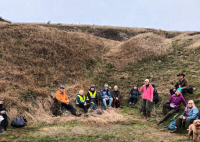 Photo of group taking a coffee break in a hollow above Seacombe – January 8, 2025