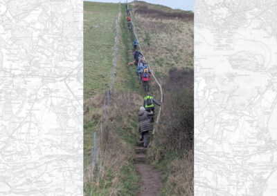 What goes down … photo of walkers on the long fight of steps up to St Aldelm's Chapel – January 18, 2025