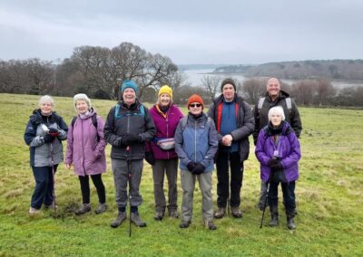 Photo of walkers with Poole Harbour in the background – January 22, 2025