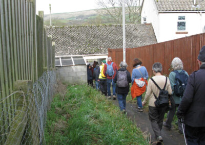 Photo no. 1 of walkers passing "through" a house at Herston – February 5, 2025