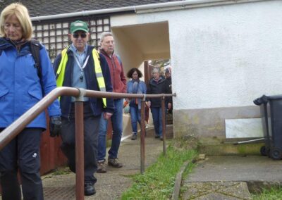 Photo no. 2 of walkers passing "through" a house at Herston – February 5, 2025