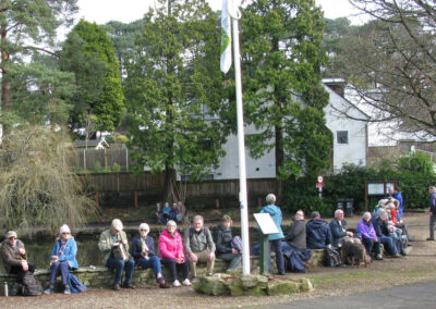 Photo of walkers taking a lunch break at Coy Pond, a decoy pond created in 1888 to lure ducks for shooting – February 22, 2025